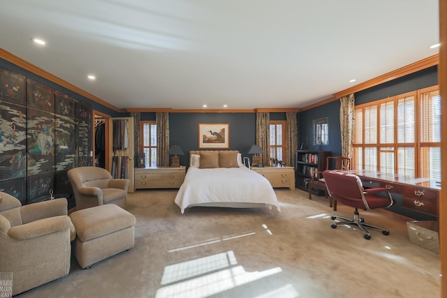 bedroom with carpet floors and crown molding