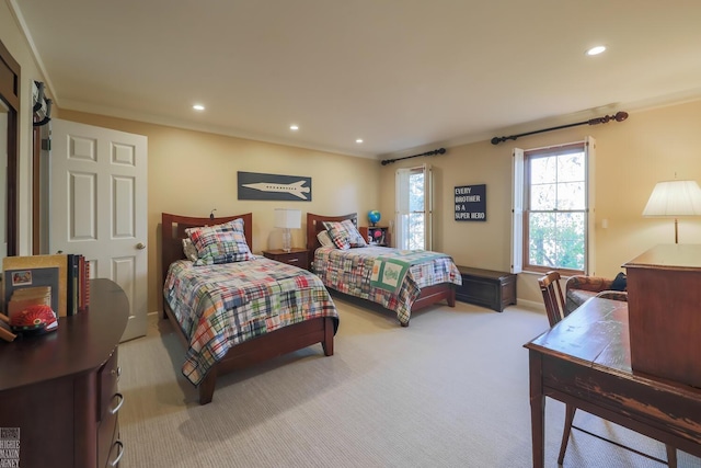 bedroom featuring light colored carpet and crown molding