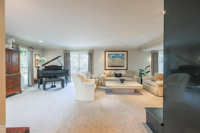 carpeted living room featuring french doors and ornamental molding