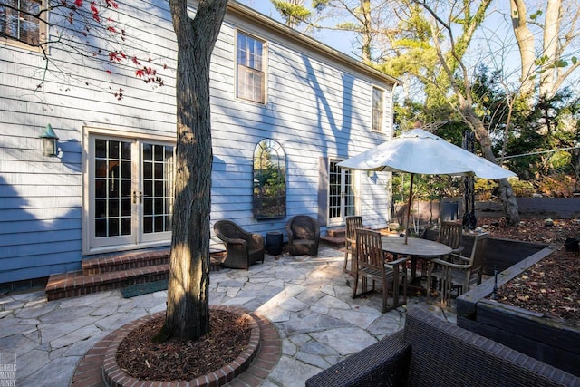 view of patio / terrace with french doors and an outdoor living space