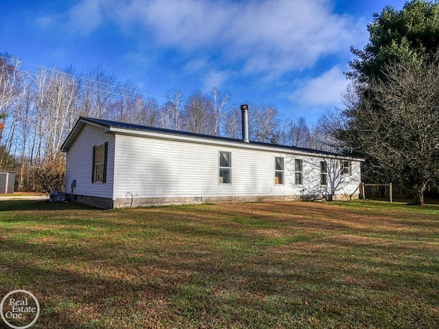 back of house featuring a yard