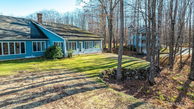 view of yard with a sunroom