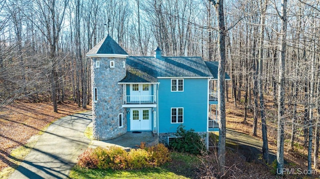 view of front of home with a balcony