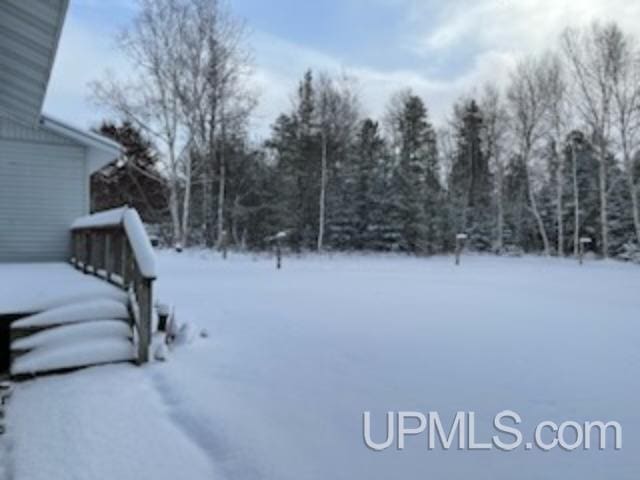 view of yard layered in snow