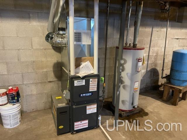 utilities featuring heating unit and water heater