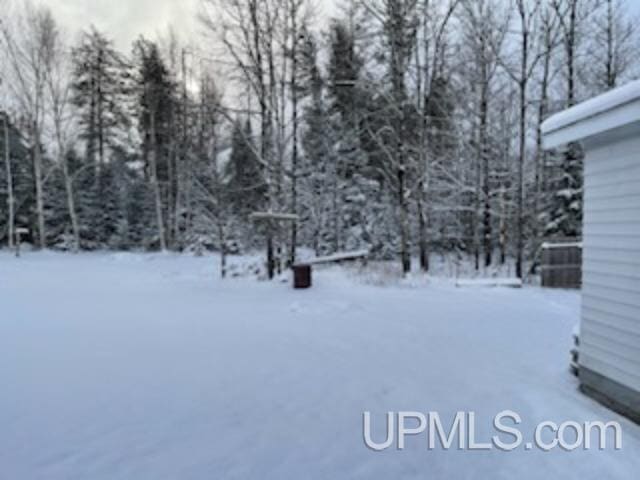 view of yard layered in snow