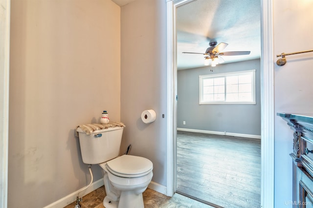 bathroom featuring ceiling fan, toilet, and hardwood / wood-style flooring