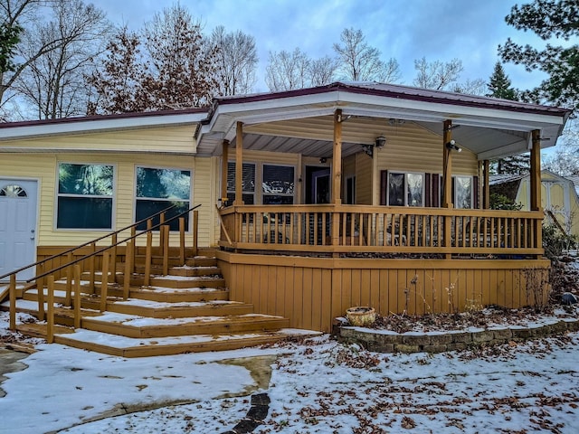 view of snow covered house