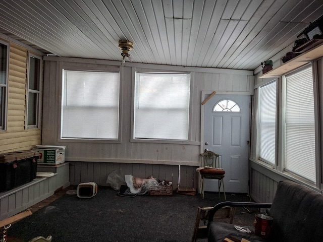 sunroom / solarium featuring wood ceiling