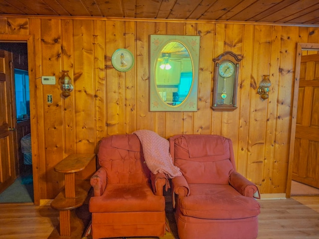 6741 Carpenter Rd, Harrison, MI 48625 - sitting room with wooden ceiling, wood finished floors, and wood walls