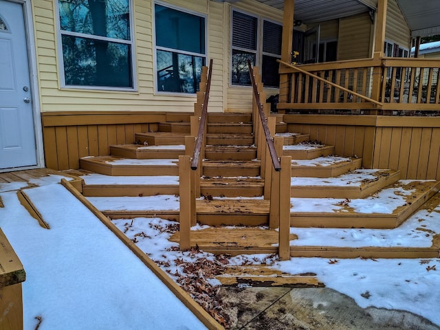 view of snow covered property entrance