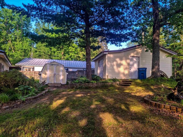 6741 Carpenter Rd, Harrison, MI 48625 - rear view of house featuring metal roof