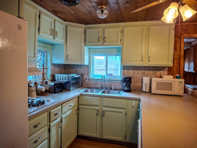 kitchen featuring ceiling fan, sink, tasteful backsplash, white appliances, and wood ceiling