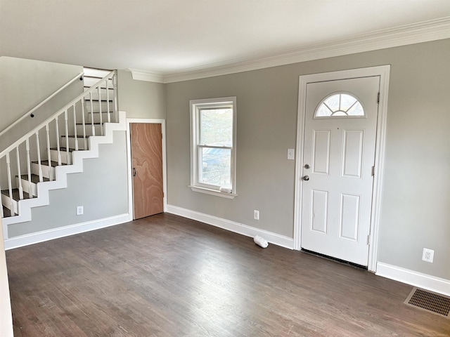 entryway with dark hardwood / wood-style flooring and ornamental molding