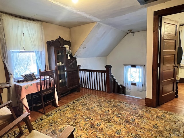 bonus room featuring hardwood / wood-style flooring and lofted ceiling