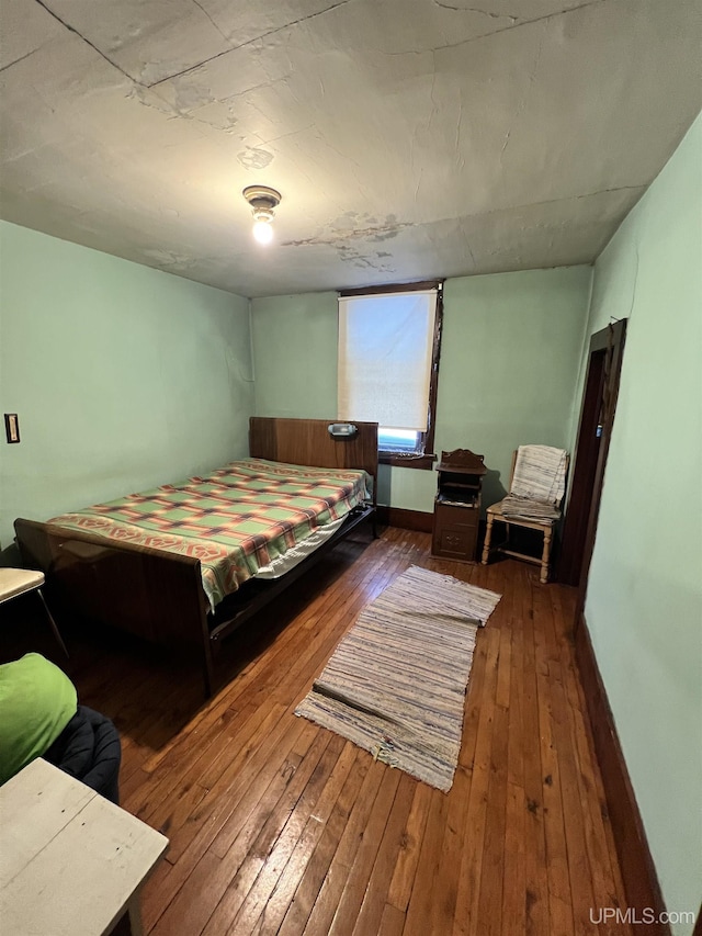 bedroom with wood-type flooring