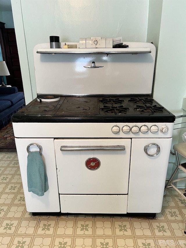 kitchen with white range with gas cooktop