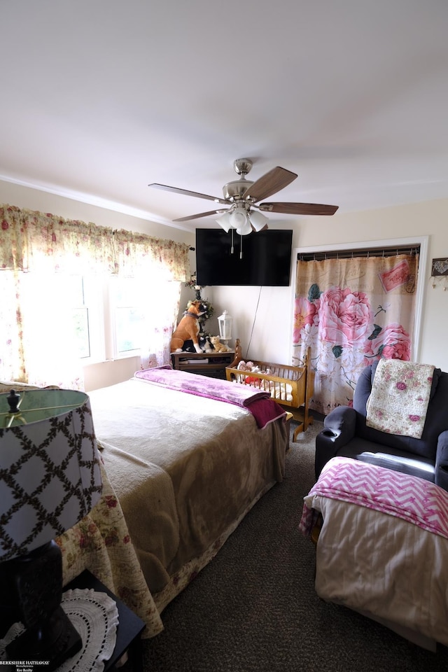 bedroom with ceiling fan and carpet floors