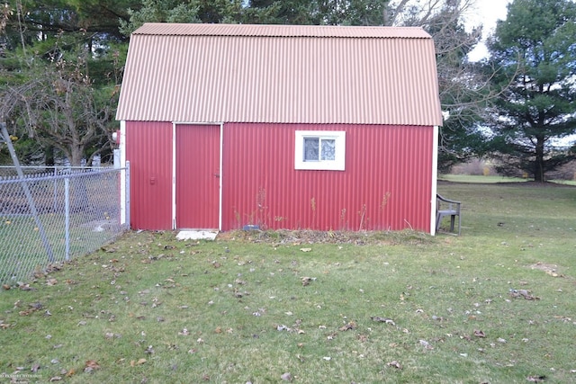 view of outdoor structure featuring a lawn