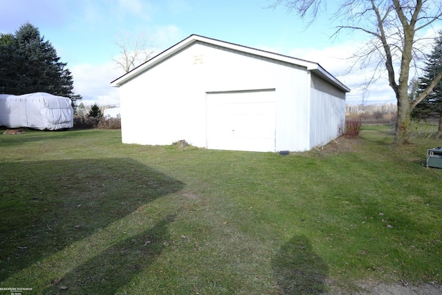 view of outdoor structure featuring a lawn