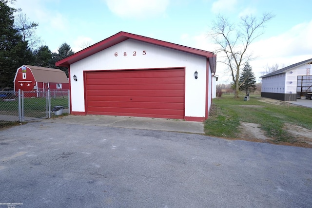 garage featuring a yard