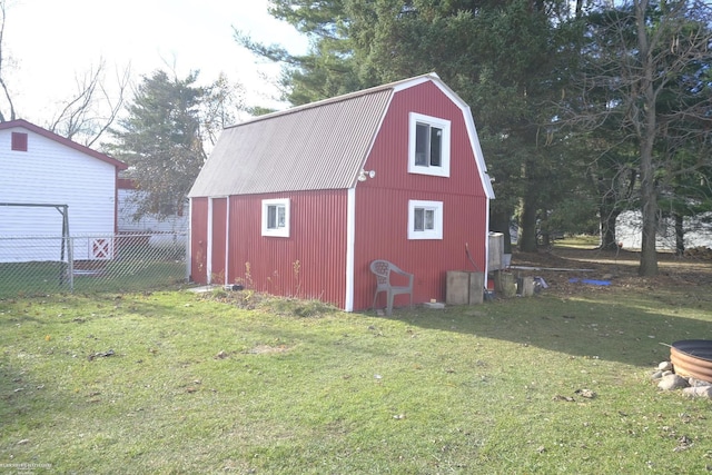 view of outdoor structure featuring a lawn