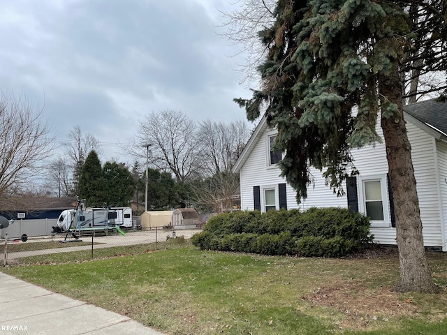 view of property exterior featuring a lawn