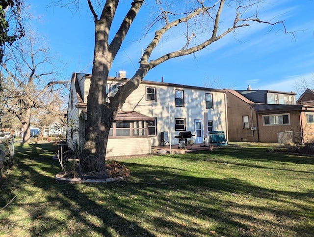 back of house featuring a yard and a patio