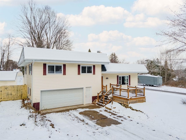 view of front of home featuring a deck and a garage