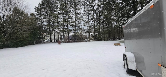 view of yard layered in snow