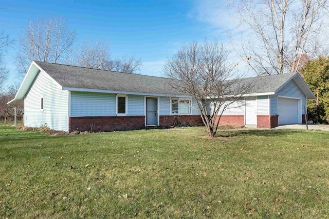 ranch-style house featuring a garage and a front lawn