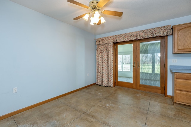 interior space with ceiling fan and french doors