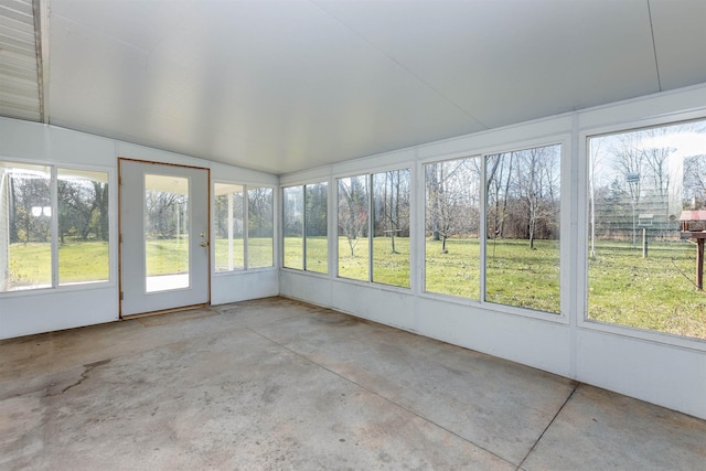 unfurnished sunroom with lofted ceiling