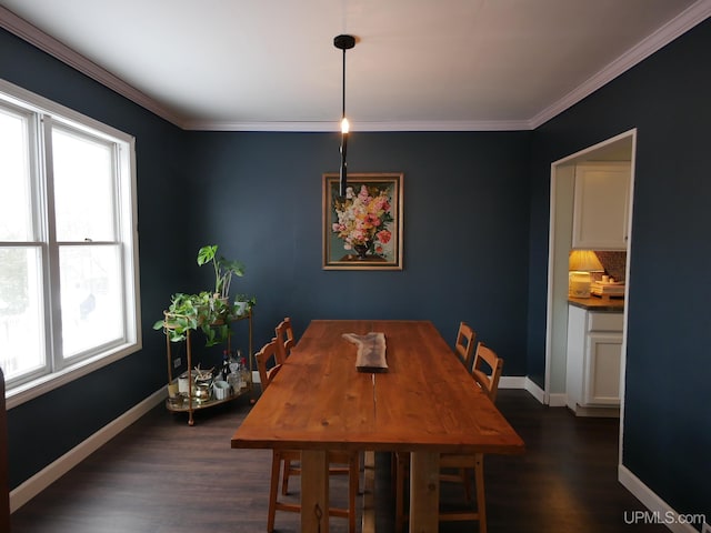 dining room featuring dark hardwood / wood-style floors and ornamental molding