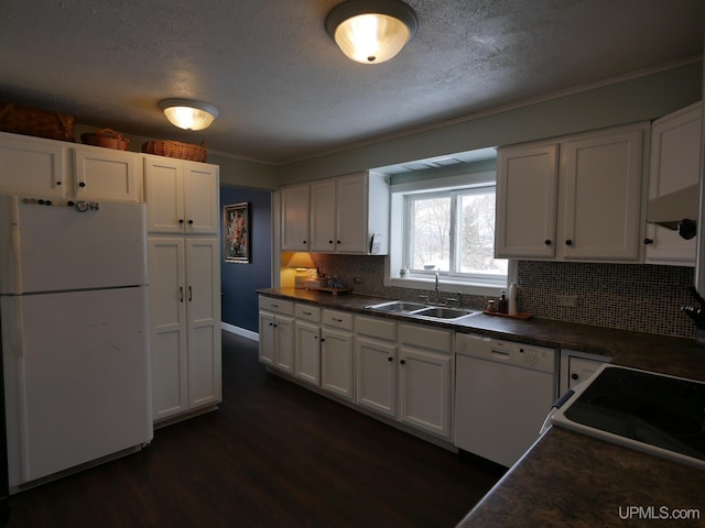 kitchen with tasteful backsplash, white appliances, dark wood-type flooring, sink, and white cabinetry