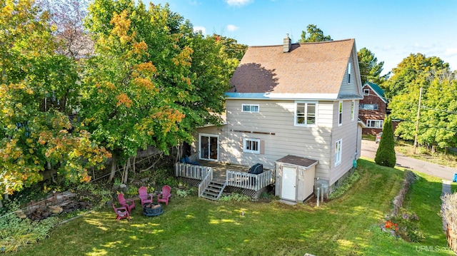 back of house with a lawn and a wooden deck