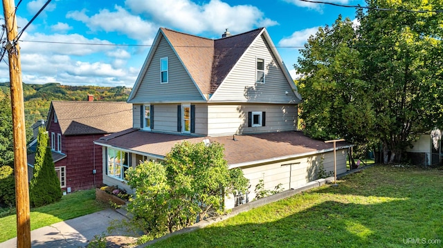 exterior space with a yard and a garage