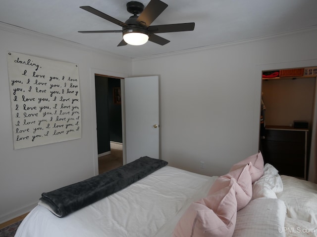 bedroom with a closet, ceiling fan, and crown molding