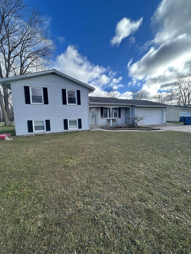 tri-level home with a front lawn and a garage