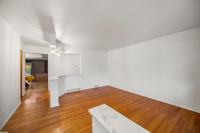 spare room featuring hardwood / wood-style flooring