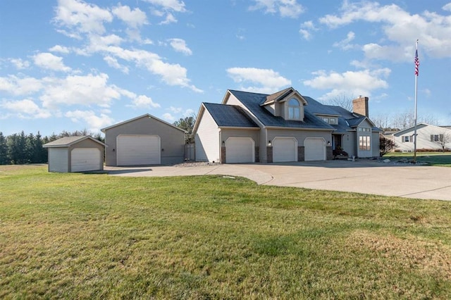 view of front of home with a front lawn and a garage