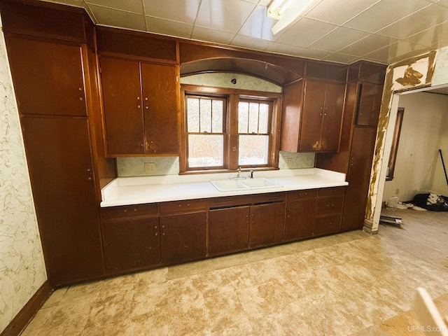 kitchen featuring sink and dark brown cabinets