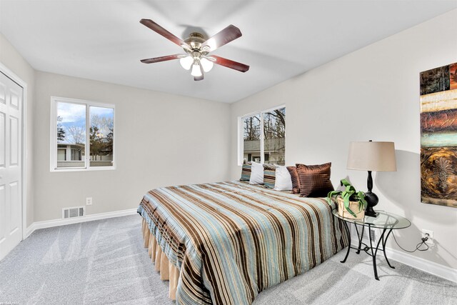 carpeted bedroom featuring ceiling fan