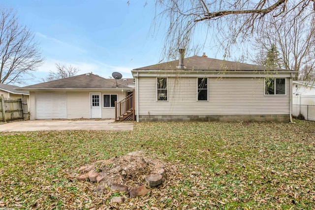 rear view of house featuring a lawn and a patio area