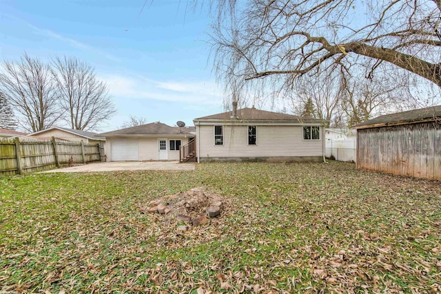 back of property featuring a yard and a patio area