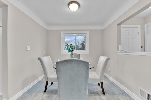 view of carpeted dining area