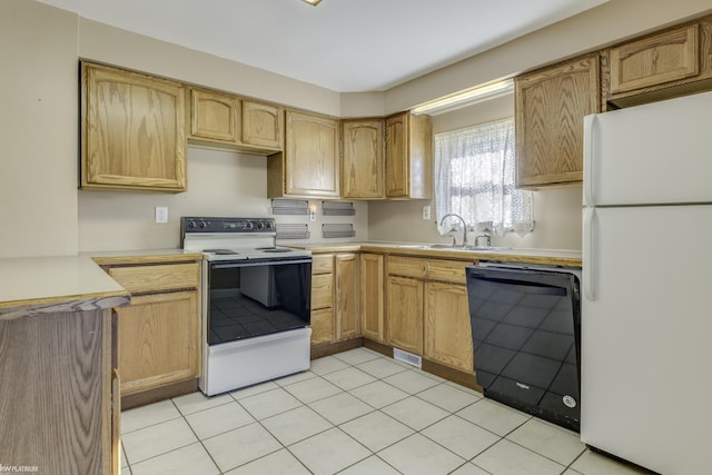 kitchen with light brown cabinetry, sink, light tile patterned flooring, and white appliances