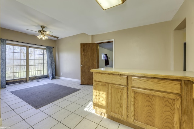 kitchen featuring ceiling fan and light tile patterned flooring