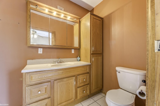 bathroom with ceiling fan, tile patterned flooring, vanity, and toilet