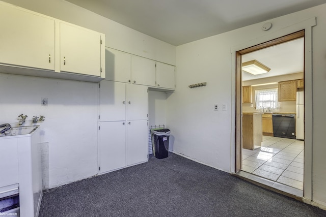 kitchen with carpet flooring and dishwasher